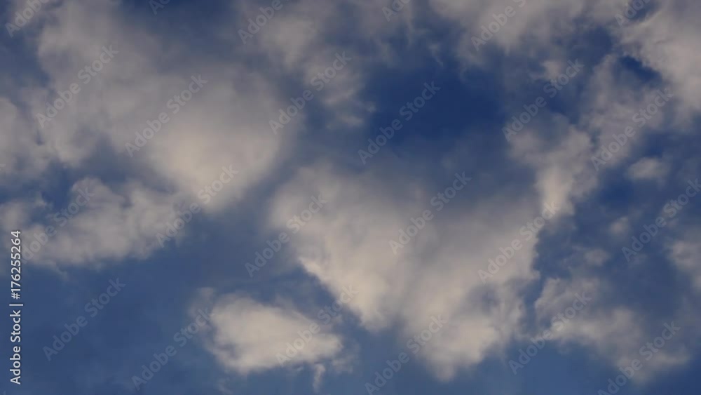 Fluffy White Clouds Float Across The Blue Sky TimeLapse Fluffy White Clouds Float Across The Blue Sky TimeLapse