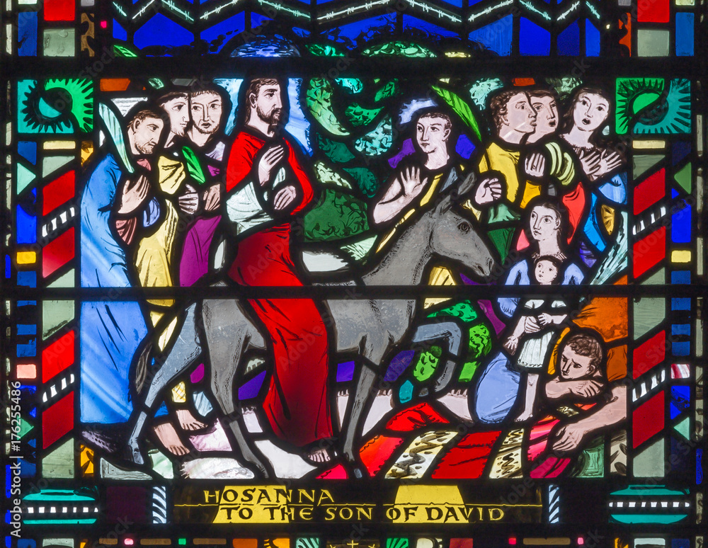 LONDON, GREAT BRITAIN - SEPTEMBER 16, 2017: The stained glass of Palm Sundy - Entry of Jesus in Jerusalem in church St Etheldreda by Charles Blakeman (1953 - 1953).
