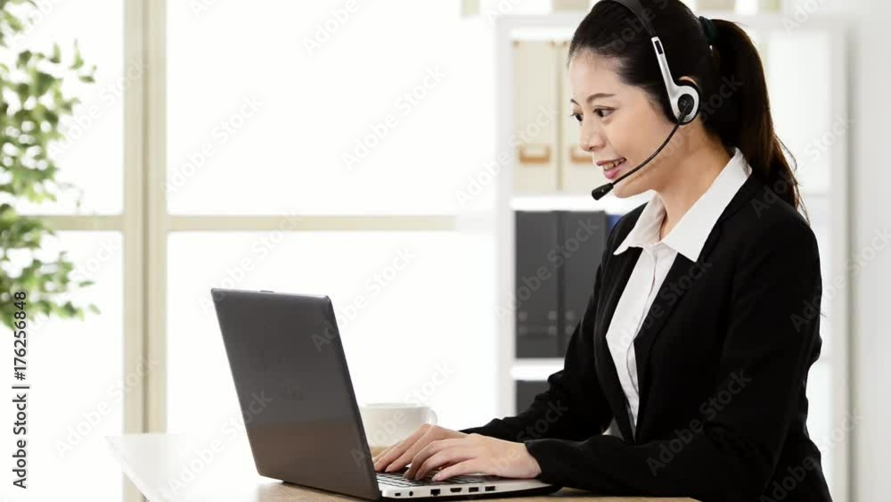 woman with a headphone and working on laptop woman with a headphone and working on laptop