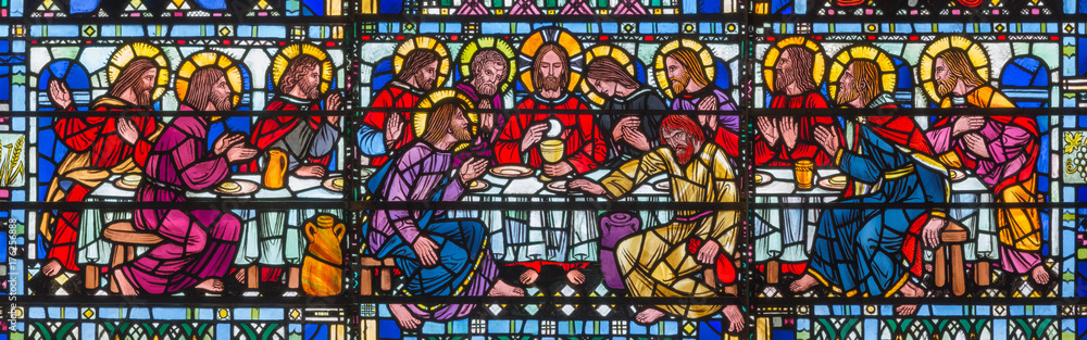 LONDON, GREAT BRITAIN - SEPTEMBER 16, 2017: The stained glass of Last Supper the Pantokrator in church St Etheldreda by Joseph Edward Nuttgens (1952).