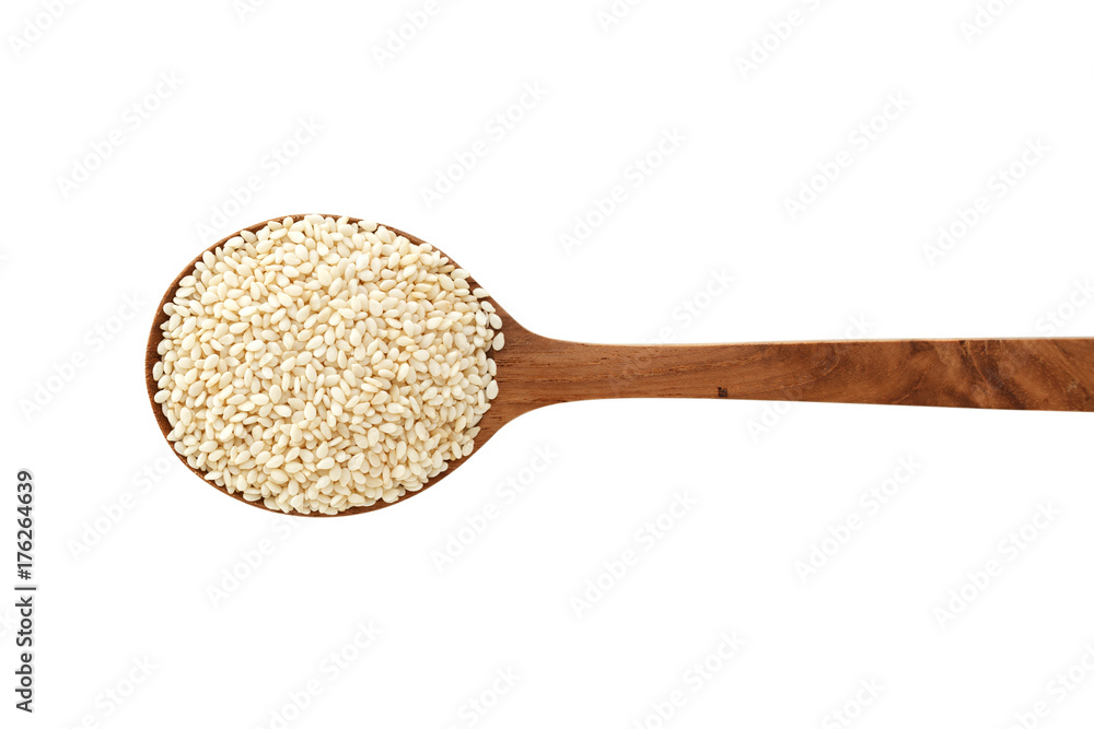 White sesame on wood spoon isolated on white background White sesame on wood spoon isolated on white background