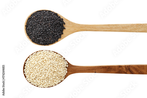 Black and white sesame on wood spoon isolated on white background