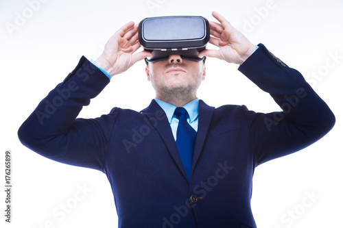 Serious intelligent man testing 3d reality glasses