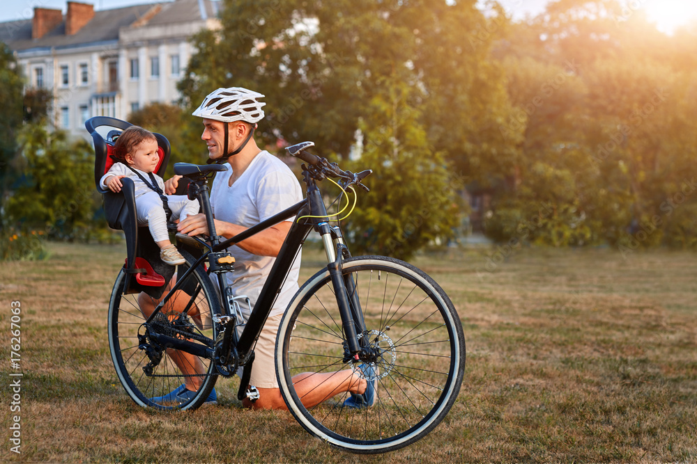 Fototapeta premium Happy family of three enjoying their time together in the park