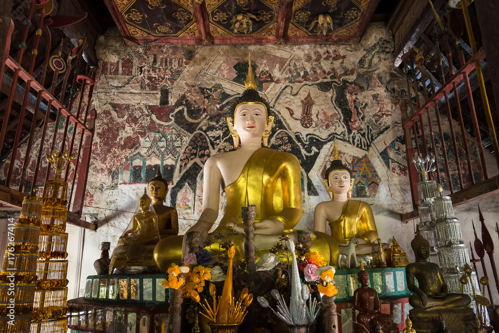 Fototapeta premium Golden buddha statue in church in Rongngae temple at Nan Province, ThailandThailand.
