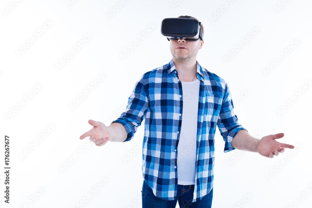 Nice good looking man using virtual reality glasses Nice good looking man using virtual reality glasses