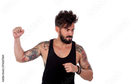 Attractive guy threatening with his fist raised