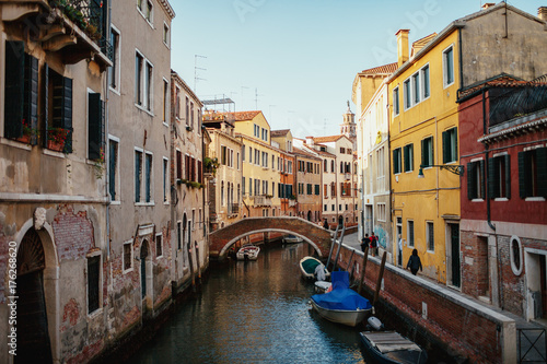 Lonely boats stand along the canal in Venice