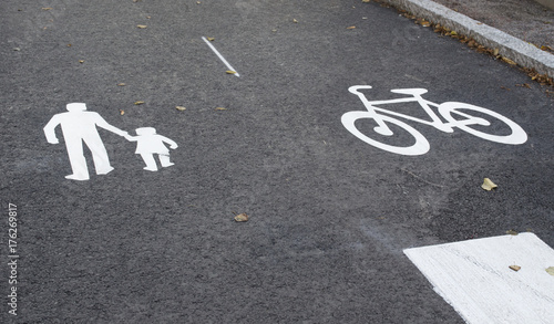 Asphalt. Marking of traffic. Bicycle path. Footpath. Background.The layout in the Finnish town of Porvoo.