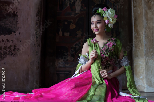 Close up of beautiful Thai woman in traditional dress costume identity culture of Thailand photo