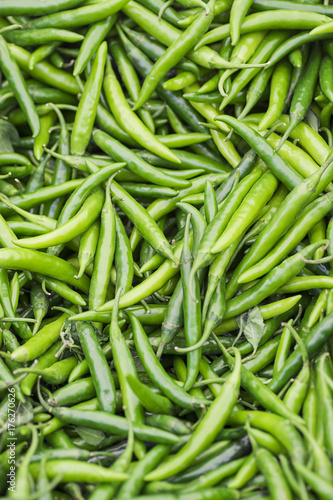 Green chili background. Vertical format