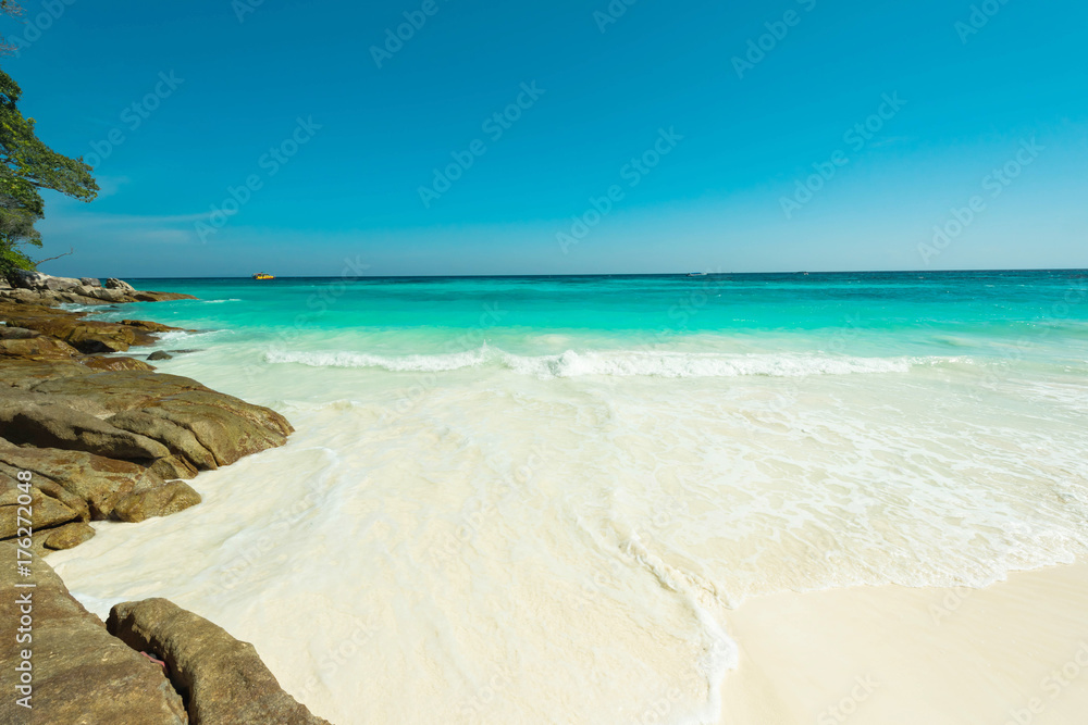 White sand beach and bright water surface at the open sea, Beautiful blue sea at Tachai island, Thailand White sand beach and bright water surface at the open sea, Beautiful blue sea at Tachai island, Thailand