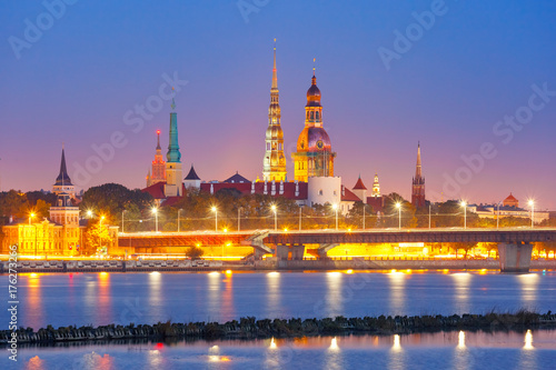 Old Town of Riga and River Daugava at night, Riga Cathedral, Saint Peter church and Riga castle in the background, Latvia