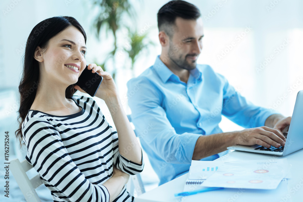 Successful young lady talking on phone Successful young lady talking on phone