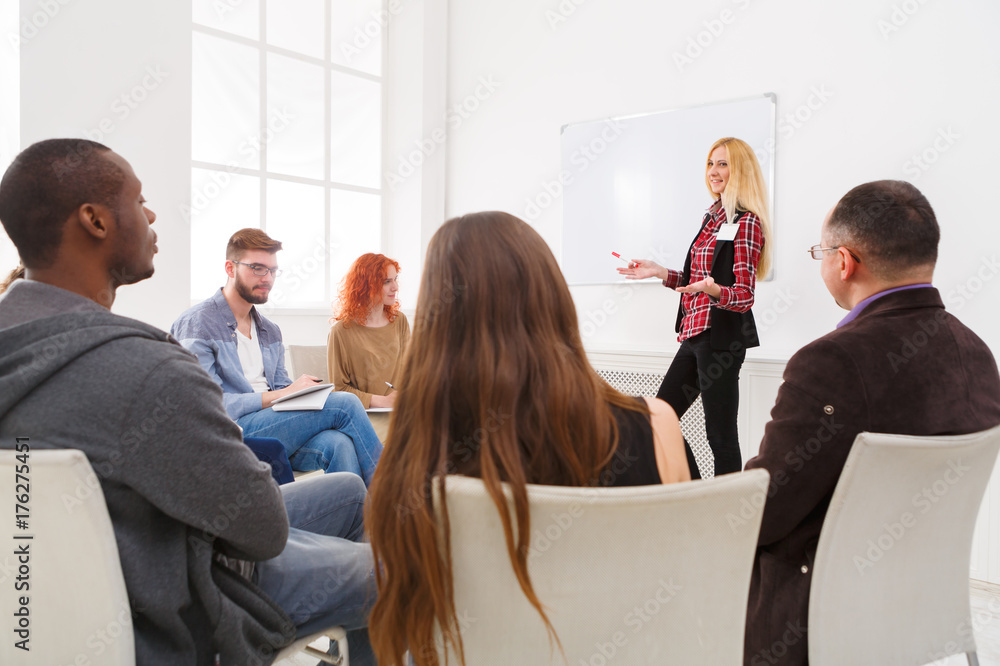 Blonde woman doing presentation in office Blonde woman doing presentation in office