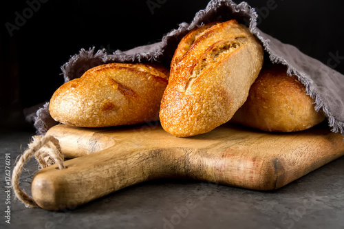 Homemade Italian bread. Fresh bakery. Dark background.