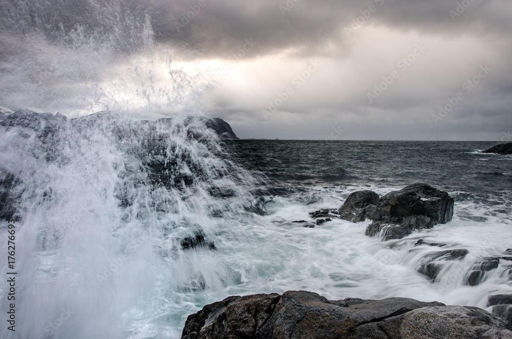 Splashing water on the wild coast of the Lofoten Islands Splashing water on the wild coast of the Lofoten Islands