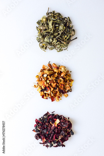 Various kind of leaf tea on a white background, top view