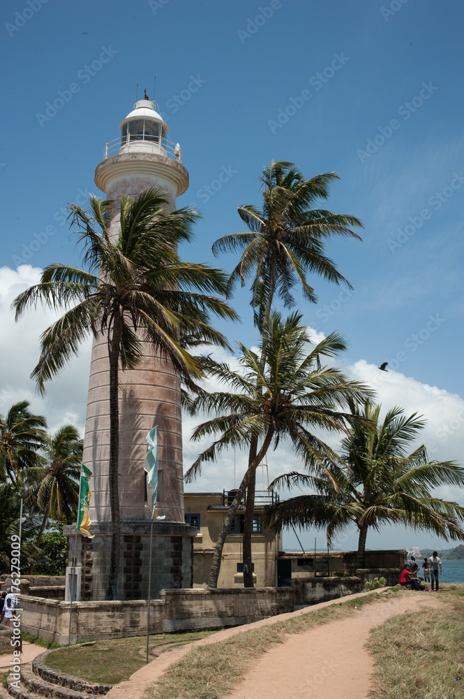 light house and palm trees in Galle, Sri Lanka