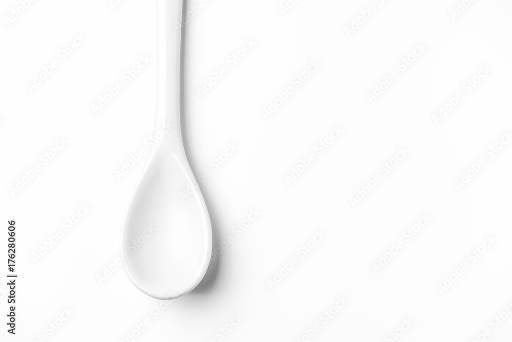White spoon isolated on a white surface White spoon isolated on a white surface