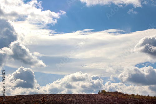 Heavenly landscape. Cloudy blanket over autumn field.  © Petia