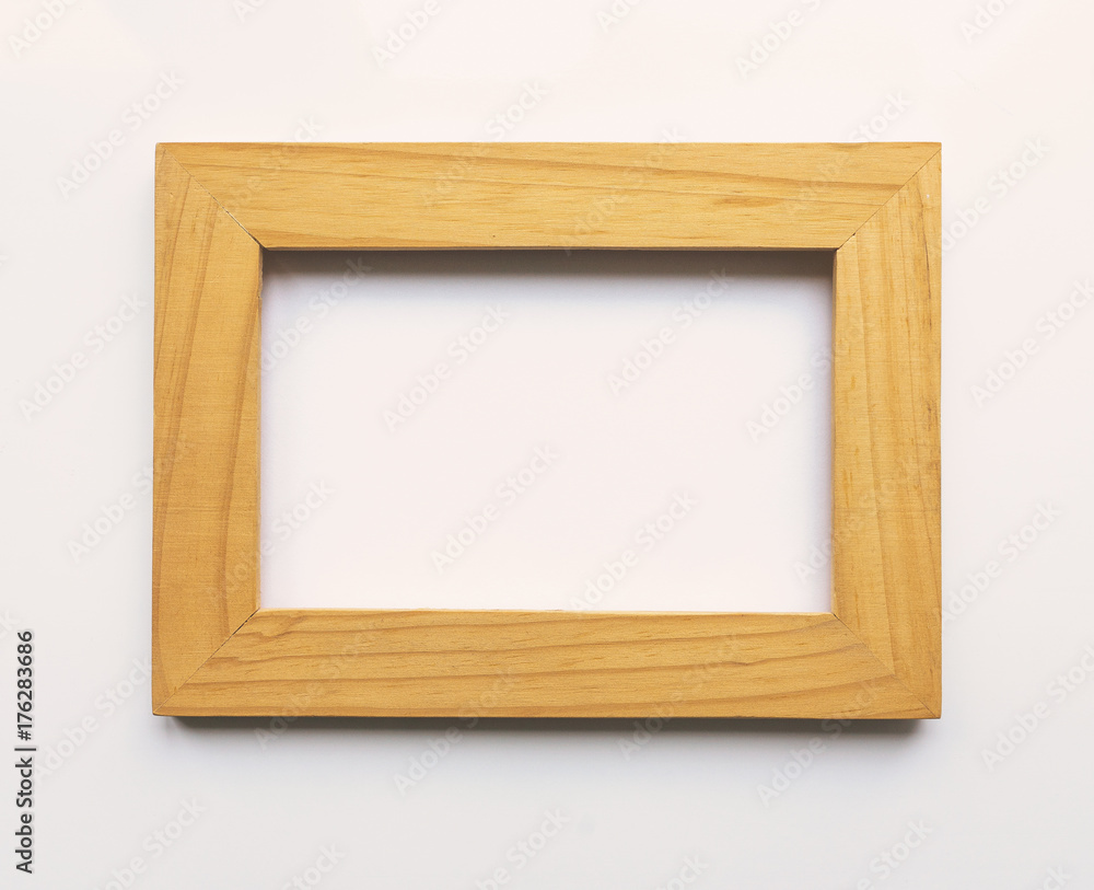 Wooden rectangular photo frame on white background. Close-up. Top view. Nobody, empty Wooden rectangular photo frame on white background. Close-up. Top view. Nobody, empty