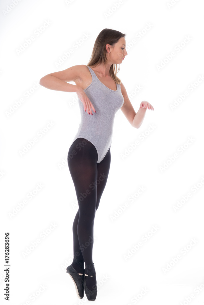 young beautiful woman dancer with long black hair wearing gray vest and tights jumping on a light white studio background young beautiful woman dancer with long black hair wearing gray vest and tights jumping on a light white studio background