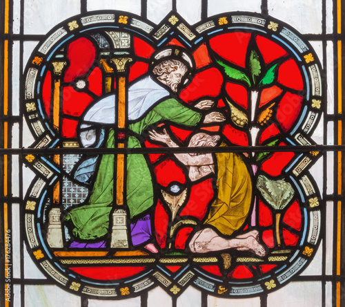 LONDON, GREAT BRITAIN - SEPTEMBER 14, 2017: The parable of Prodigal son on the stained glass in the church St. Michael Cornhill by Clayton and Bell from 19. cent.