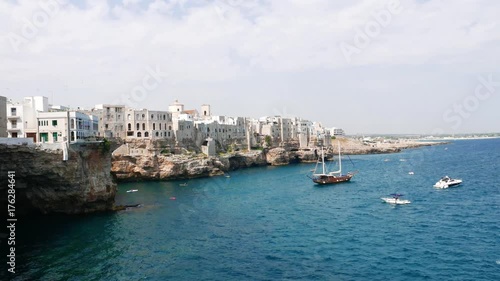 Wallpaper Mural Polignano a Mare breathtaking sight panorama. Cliffs on Adriatic sea and boat. Puglia. Italy Torontodigital.ca