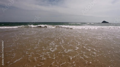 Tropical beach - waves hitting sand beach; steadicam footage, no people; South China Sea, Guangdong province, China photo