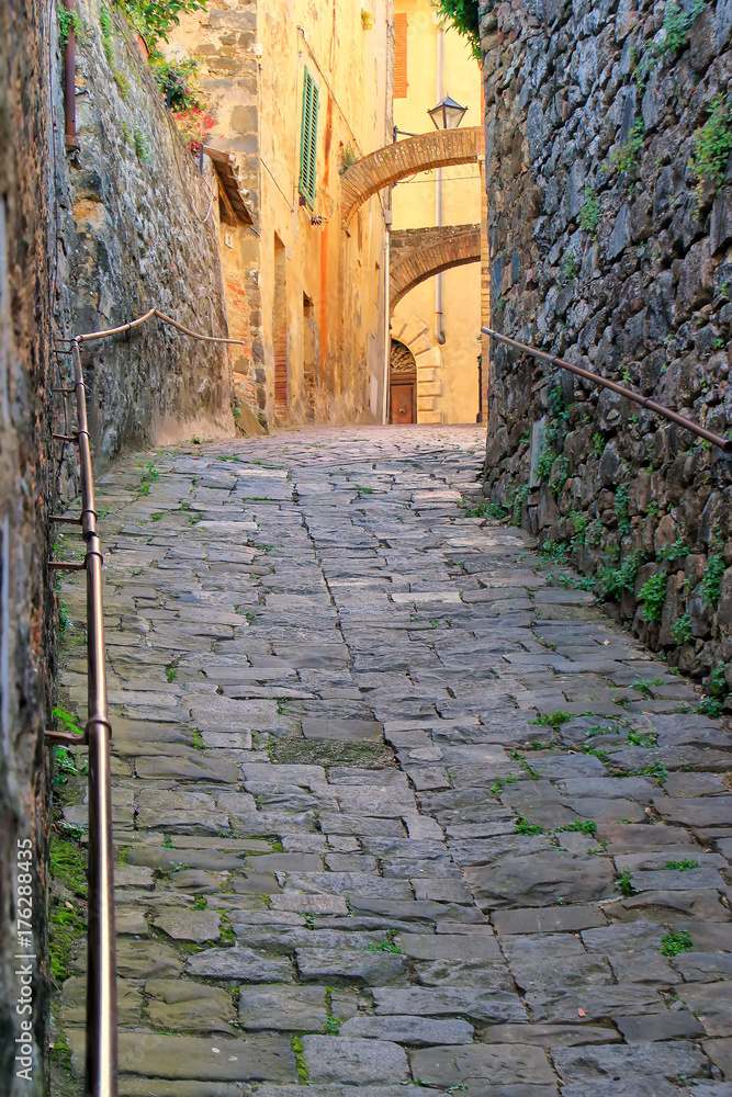 Narrow street in historic center of  Montalcino town, Val d'Orcia, Tuscany, Italy