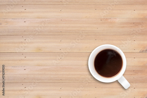 Top view, Black coffee in whtie mug with faded shadow. copyspace for text. isolated on wooden texture background with Clipping path.