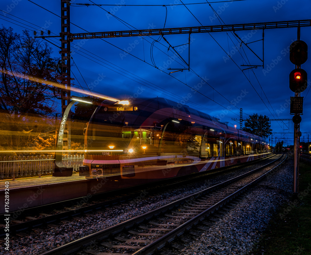 Railroad platform in autumn, with long exposure