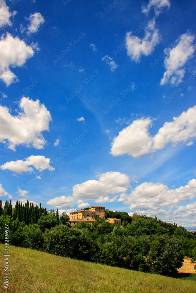House surrounded by trees in Val d'Orcia, Tuscany, Italy