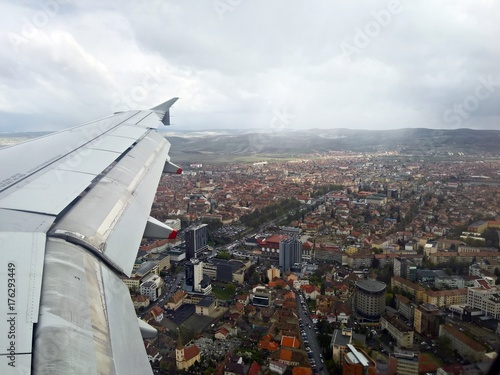 Flying over the city - Top view from plane, over Munich city, Germany