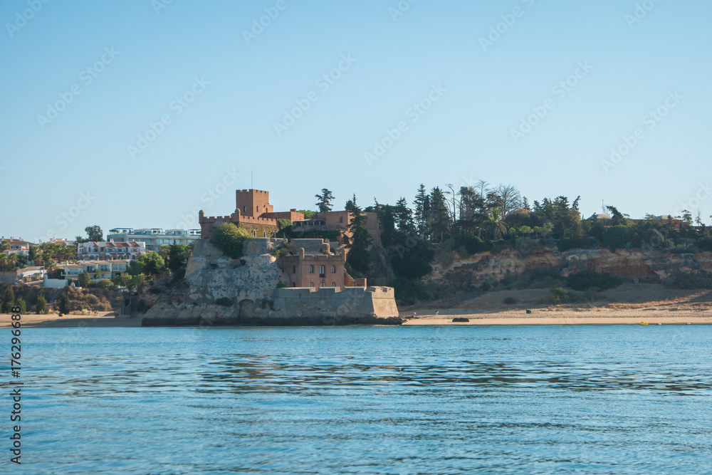 The magnificent Fort of Sao Joao do Arade in Ferragudo, sometimes referred to as the Castle of Arade, viewed from the Port of Portimao The magnificent Fort of Sao Joao do Arade in Ferragudo, sometimes referred to as the Castle of Arade, viewed from the Port of Portimao