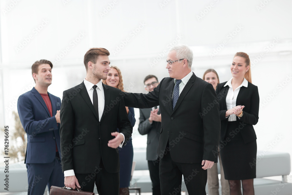 portrait of business partners on the background of business team. portrait of business partners on the background of business team.
