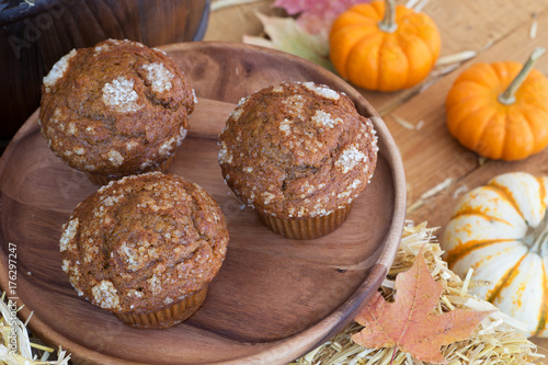 Delicious Pumpkin Muffins on a Wooden Plate