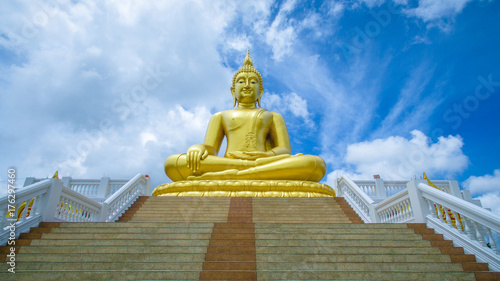 The big golden Buddha statue in Ayutthaya, Thailand. sky background.