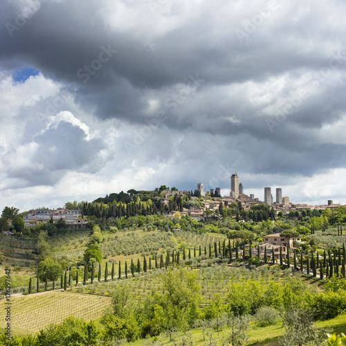 rainy clouds above old city in Tuscany in Italy