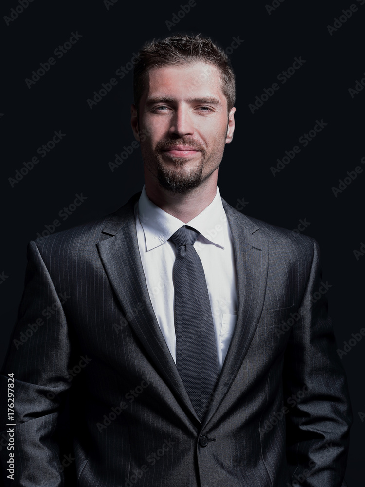 Handsome mature business man isolated on black background Handsome mature business man isolated on black background