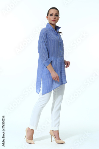 indian business woman in casual blue shirt white trousers clothes full body length photo in stiletto heels isolated on white photo