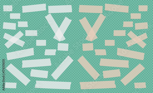 Brown and white different size adhesive, sticky, scotch tape, paper pieces on green squared background.