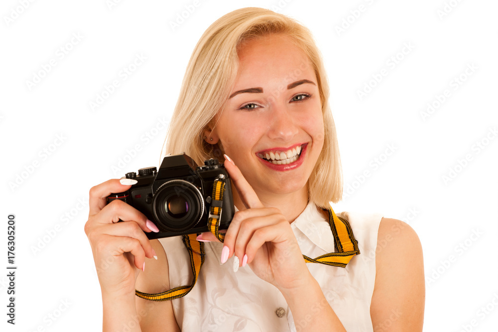 active young woman taking photos with retro camera isolated over white background