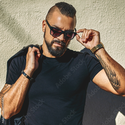 Fashion portrait of handsome brutal man in sunglasses