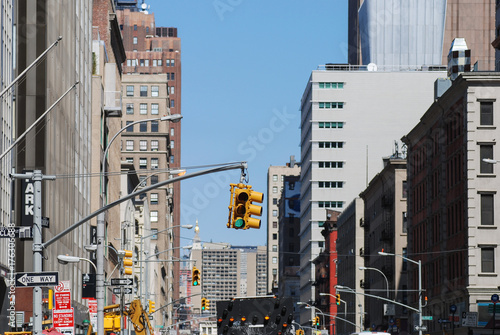 View on street in Manhattan in New York City with traffic light 