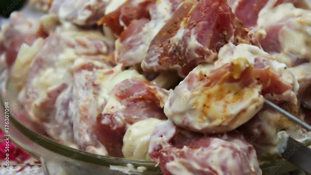 Delicious appetizing pieces of a fresh meat strung on skewers ready for barbecue Delicious appetizing pieces of a fresh meat strung on skewers ready for barbecue