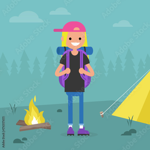 Young female backpacker traveling in a forest