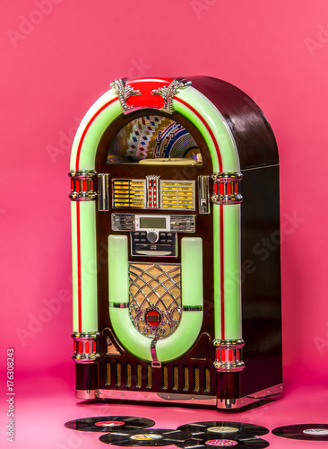 vintage jukebox on pink background in pin-up style