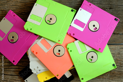 stack of floppy disk on wooden floor